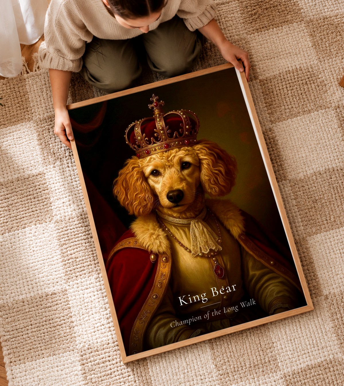 A framed royal pet portrait, personalised with the pet's name, held up in a warm, sunlit living room